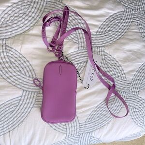 A Thacker wallet and color is discontinued. New with tags and never used.